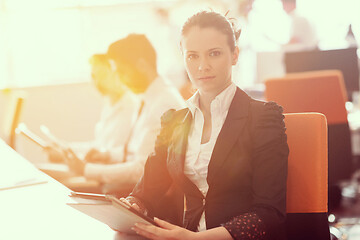 Image showing business woman at  office people group on meeting  in background