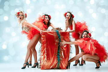 Image showing young beautiful dancers posing on studio background