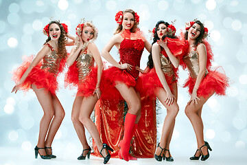 Image showing young beautiful dancers posing on studio background