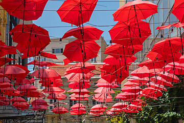 Image showing Red Umbrellas Hanging