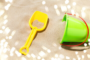 Image showing close up of toy bucket and shovel on beach sand