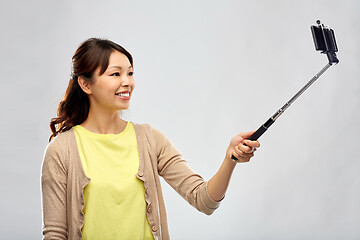 Image showing asian woman taking selfie by smartphone