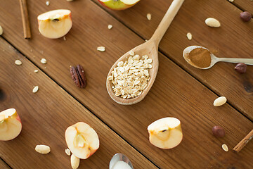 Image showing apples, oatmeal, cinnamon, nuts and sugar