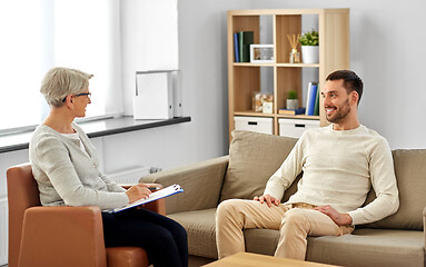 Image showing senior woman psychologist and young man patient