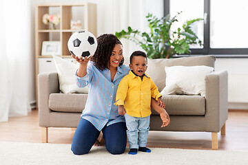 Image showing mother and baby playing with soccer ball at home