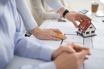 Image showing close up of architects discussing house project