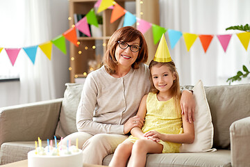 Image showing grandmother and granddaughter with birthday cake