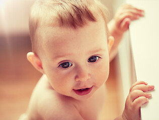 Image showing happy little baby boy or girl at home