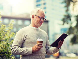 Image showing senior man with tablet pc and coffee in city