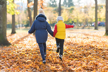Image showing happy children running at autumn park