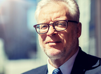 Image showing close up of senior businessman in eyeglasses