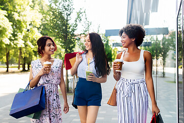 Image showing women with shopping bags and drinks in city