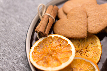 Image showing gingerbread with dried oranges and cinnamon