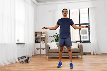 Image showing indian man exercising with jump rope at home