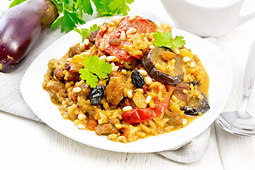 Image showing Rice with vegetables and chicken in plate on wooden board