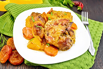 Image showing Chicken roast with pumpkin and dried apricots on green napkin