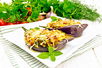 Image showing Eggplant stuffed brisket and vegetables in plate on light board