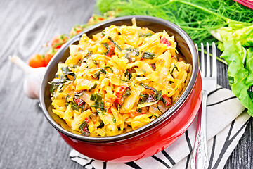 Image showing Cabbage stew with chard in bowl on towel