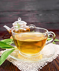 Image showing Tea herbal with sage in glass cup on board