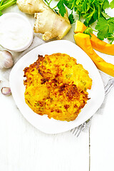 Image showing Pancakes of pumpkin in plate on board top