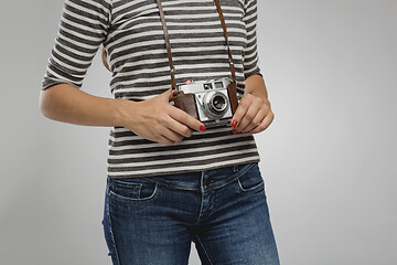 Image showing Woman with her vintage camera