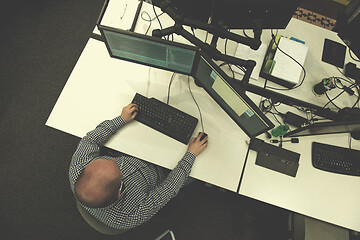 Image showing young programmer writing programming code top view