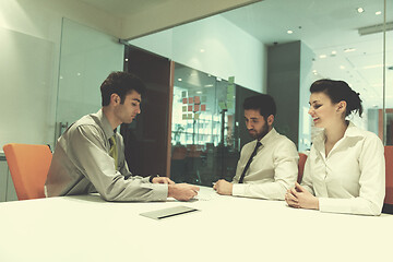 Image showing young couple signing contract documents on partners back