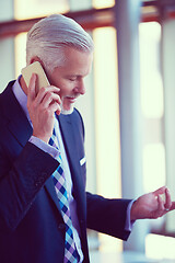 Image showing senior business man talk on mobile phone