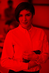 Image showing hispanic businesswoman with tablet at meeting room