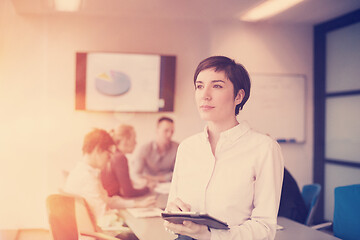 Image showing business woman on meeting  using tablet computer