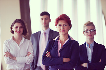 Image showing diverse business people group with redhair  woman in front