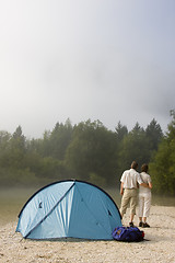 Image showing Couple beside a tent in the mountains