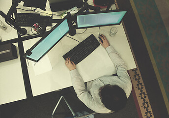 Image showing young programmer writing programming code top view