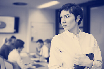 Image showing business woman on meeting  using tablet computer