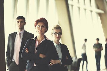 Image showing diverse business people group with redhair  woman in front