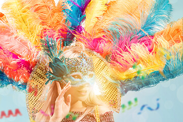 Image showing Beautiful young woman in carnival mask