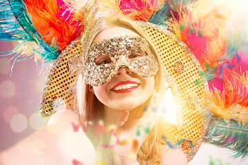 Image showing Beautiful young woman in carnival mask