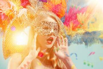 Image showing Beautiful young woman in carnival mask