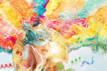 Image showing Beautiful young woman in carnival mask