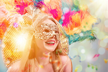 Image showing Beautiful young woman in carnival mask