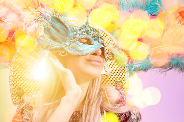 Image showing Beautiful young woman in carnival mask