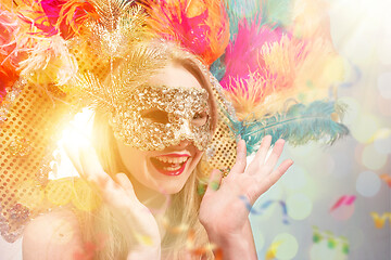 Image showing Beautiful young woman in carnival mask