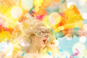 Image showing Beautiful young woman in carnival mask