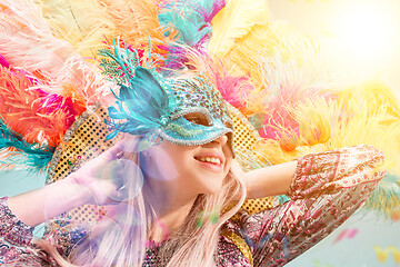 Image showing Beautiful young woman in carnival mask