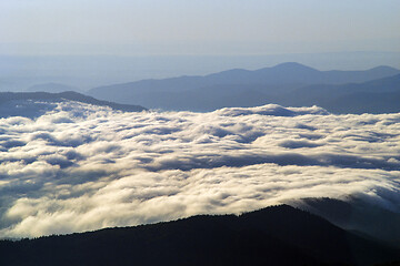 Image showing Clouds covering the river valley at sunrise