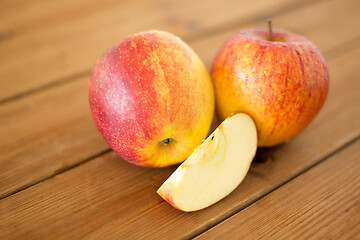 Image showing ripe red apples on wooden table