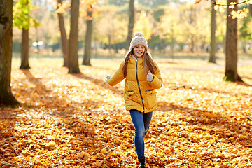 Image showing happy girl running in autumn park