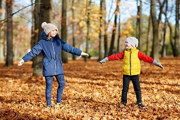 Image showing happy children having fun at autumn park