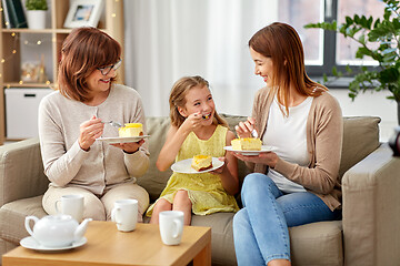 Image showing mother, daughter and grandmother eating cake