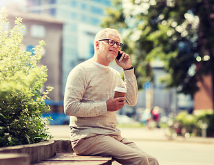 Image showing happy senior man calling on smartphone in city